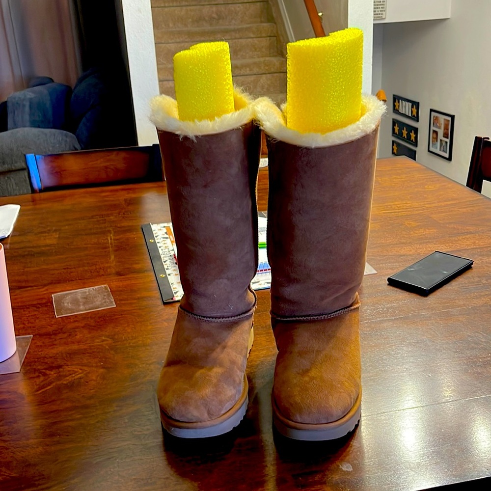 These UGG boots are a tan color, fuzz on the inside, brand new!